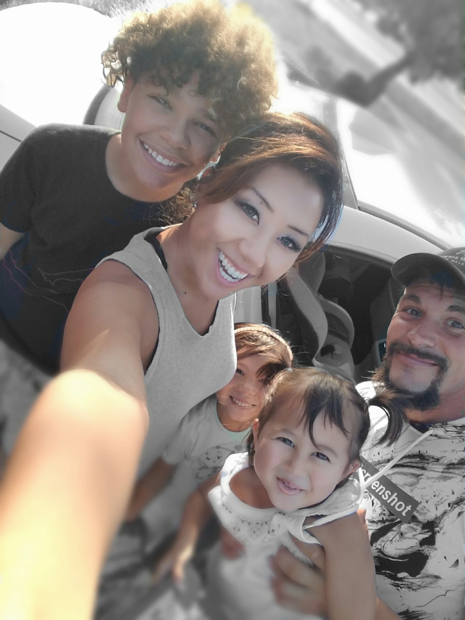 A family selfie with Christopher, Mainhia and the children